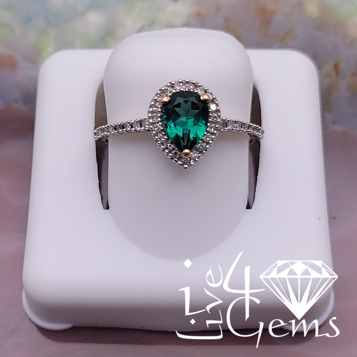 10ktw 1/6ctw Diamond 3/4ct Lab Emerald Pear Ring