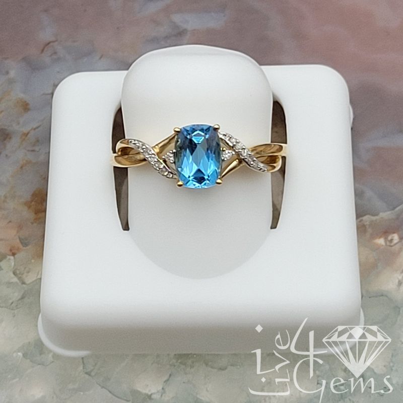 10kt  0.05ctw Diamond Blue Topaz Spiral Ring