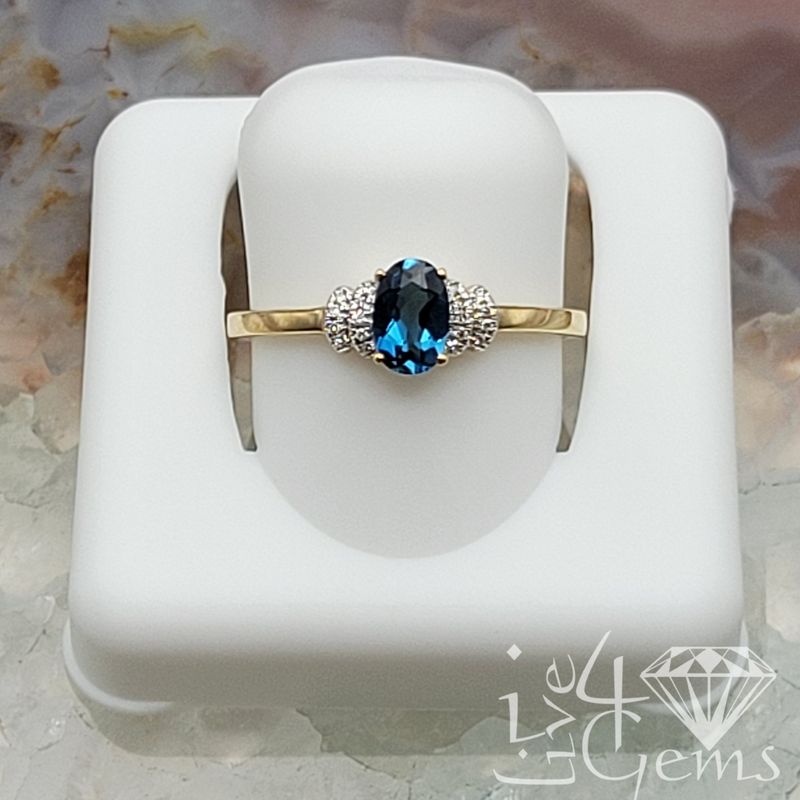 10kty 0.05ctw Diamond Oval London Blue Topaz Ring