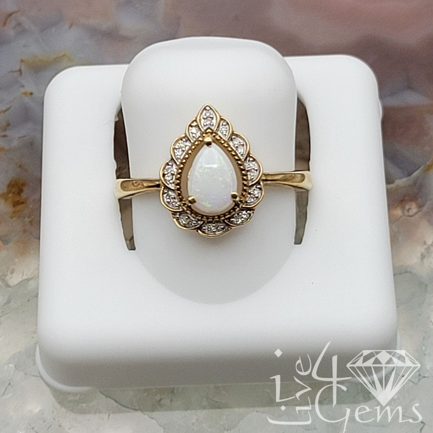 10kty 0.10ctw Diamond and Opal Pear Ring