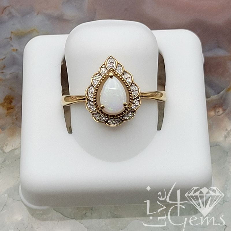 10kty 0.10ctw Diamond and Opal Pear Ring