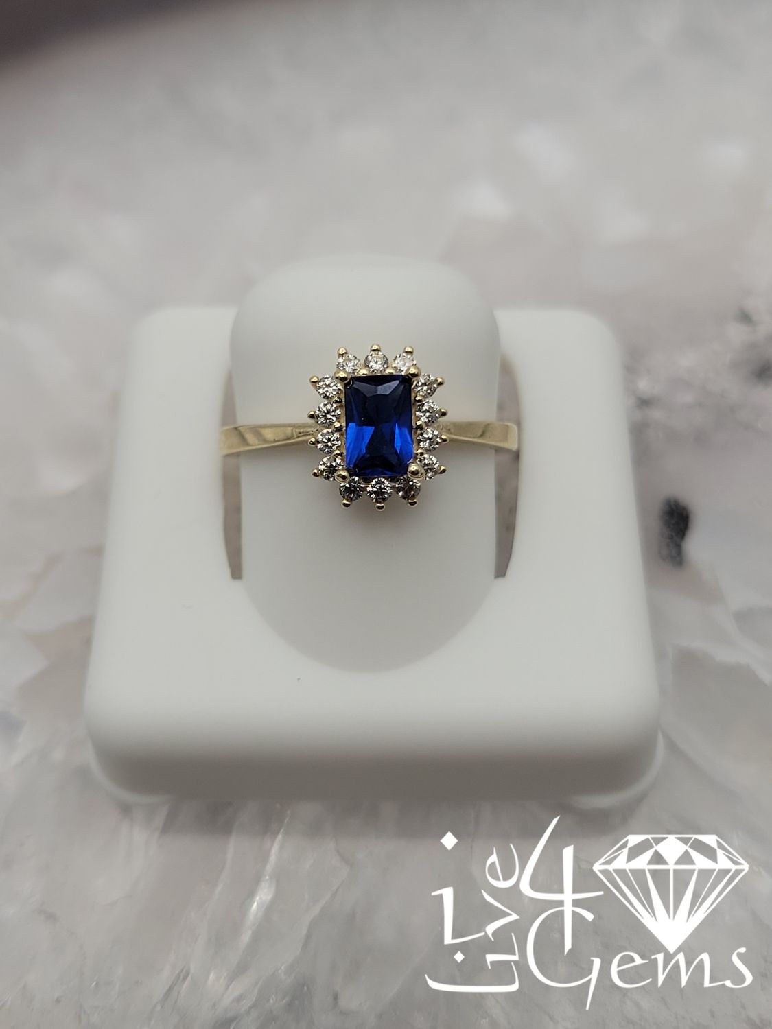 10kty Blue Cz Emerald Cut Halo Ring