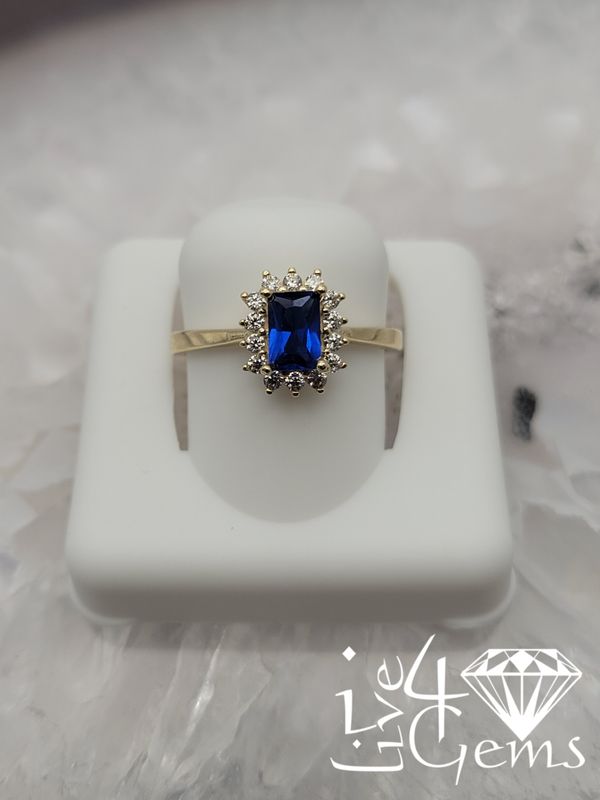 10kty Blue Cz Emerald Cut Halo Ring