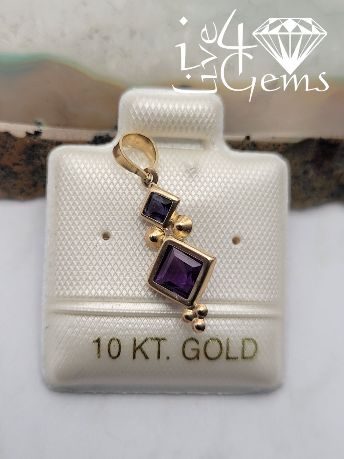 10kty 0.70cts Amethyst and 0.15ct Iolite Princess Cut Pendant