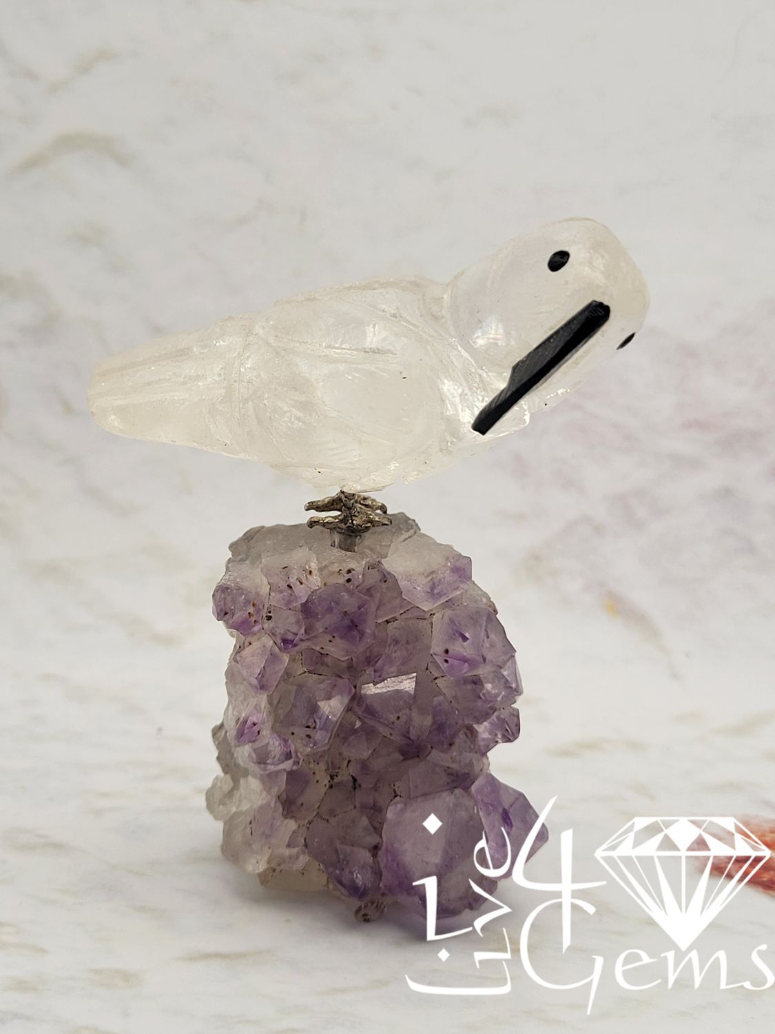 Gemstone Bird Carving on Amethyst