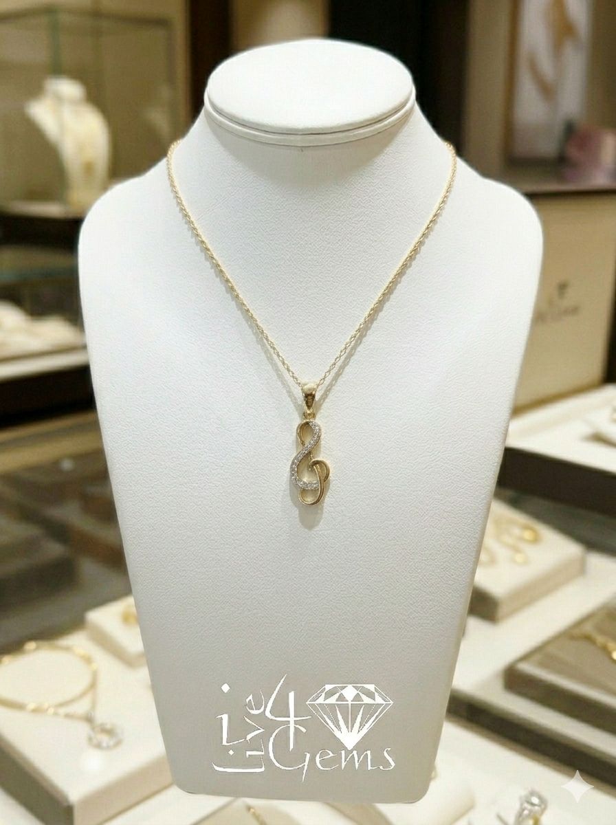 10kty Gold Diamond Music Note Pendant and Chain 0.06ctw