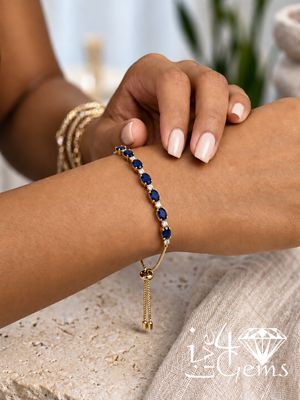 10kty 0.25 Diamond and Sapphire Gemstone Bolo Bracelet
