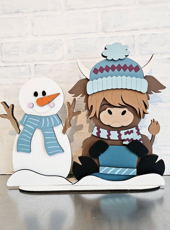 WINTER HIGHLAND COW WITH SNOWMAN