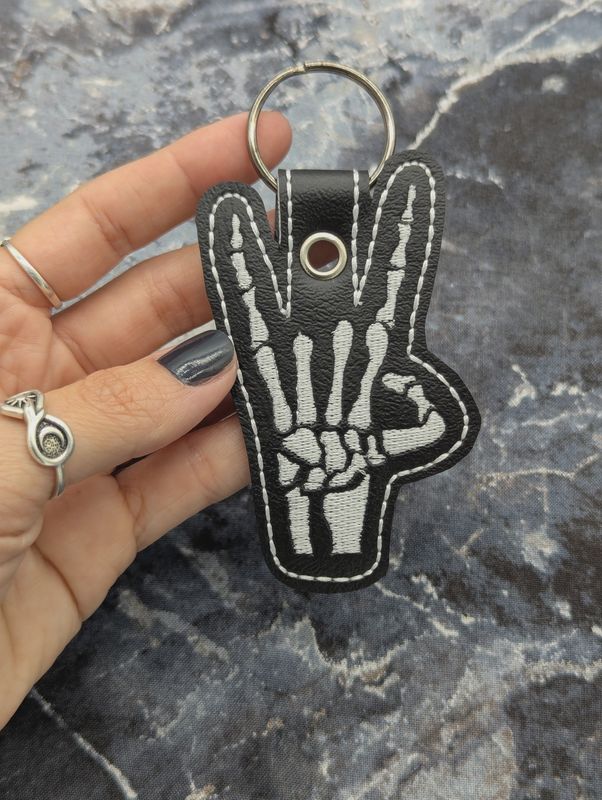 Skeleton Rock Hand Keychain