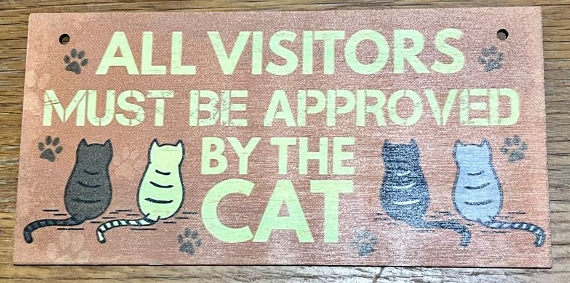 "All Visitors" wooden cat sign