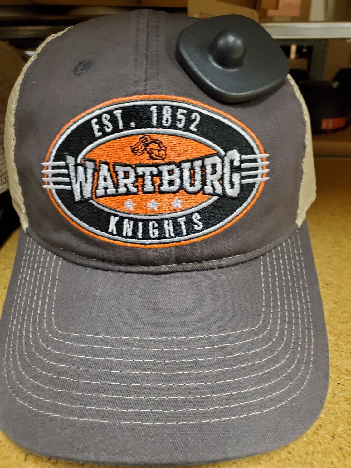 Charcoal cap sporting 1852 Wartburg Knights