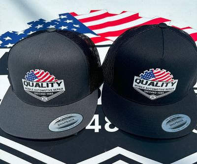 grey and black hats with company logo