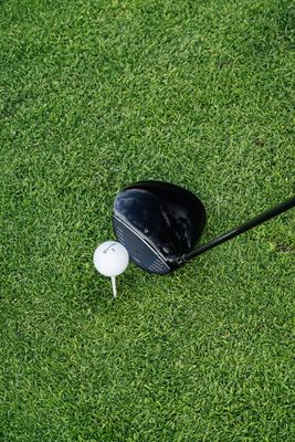 The driver features a sleek design with a large clubhead, ideal for achieving long-distance shots on the golf course.