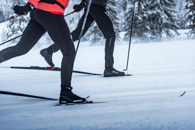 Cross-country ski boots for warmth and support, designed for optimal performance and comfort.