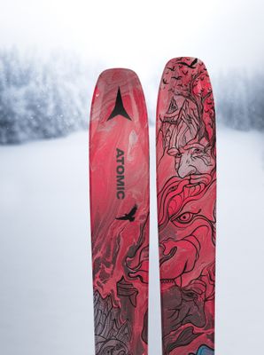 Pair of downhill skis with a sleek design, wide edges, and a durable base for smooth, controlled rides on snow.