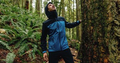 Men&#39;s waterproof rain jacket with adjustable hood and zip front, designed to keep you dry and comfortable in wet weather.