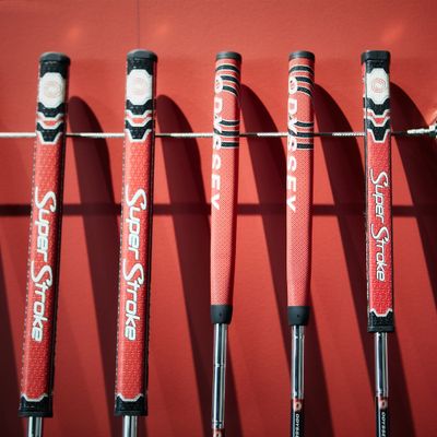 The grips come in various colors and textures, designed to provide comfort and control during putting.