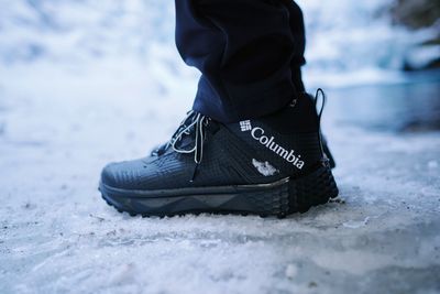 Men&#39;s waterproof winter boots with insulated lining and non-slip sole for warmth and traction in snowy conditions.