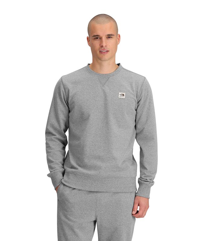 FRONT MODEL VIEW OF THE NORTH FACE MENS HERITAGE PATCH CREW SWEATER WITH SET-IN SLEEVES AND RIB ON …