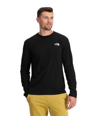 FRONT MODEL VIEW OF THE NORTH FACE MENS EVOLUTION LONG SLEEVE SHIRT WITH DROPPED SHOULDERS AND STAN…
