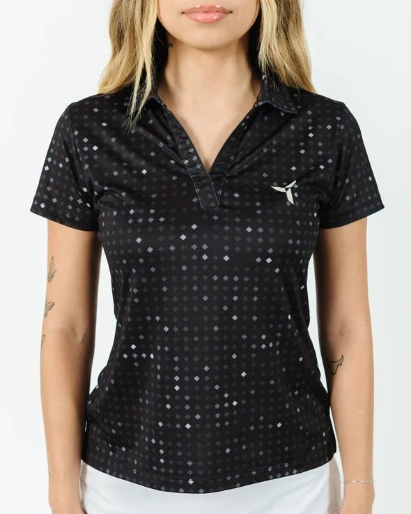 FRONT VIEW OF YATTA WOMENS BLACK GLITTER GOLF POLO FEATURES 4-WAY STRETCH, MOISTURE WICKING, AND WR…