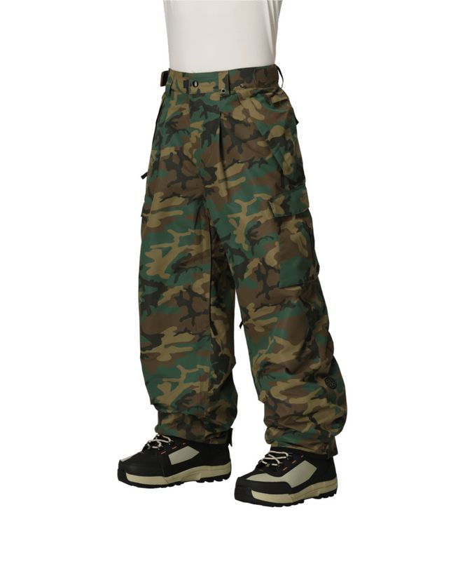 FRONT VIEW OF 686 MENS ESSOX CARGO SNOW PANT FEATURES BOOT GAITER, CARGO POCKETS, CRITICALLY TAPED …