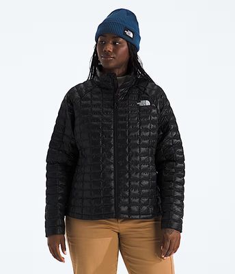 FRONT VIEW OF THE NORTH FACE WOMENS PLUS THERMOBALL™ WINTER JACKET FEATURES WINDPROOF FABRIC AND WA…