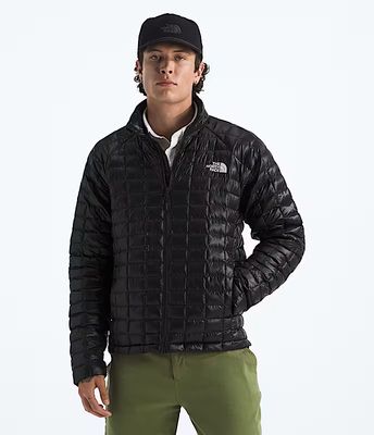 FRONT VIEW OF THE NORTH FACE MENS THERMOBALL™ WINTER JACKET FEATURES WATER REPELLENCY AND ZIP HAND …