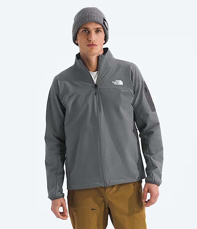 FRONT VIEW OF THE NORTH FACE MENS TEK APPROACH SOFTSHELL JACKET FEATURES STRETCH FABRIC AND WATER R…