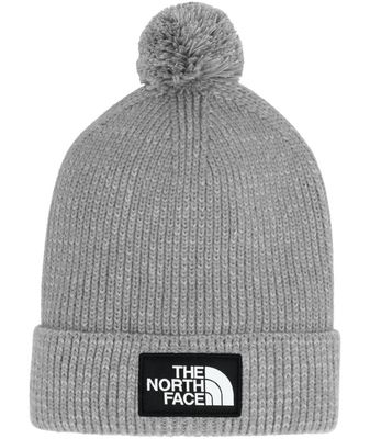 FRONT VIEW OF THE NORTH FACE UNISEX TNF™ LOGO BOX POM BEANIE WINTER HAT FEATURES REMOVEABLE POM AND…