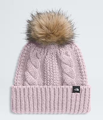 FRONT VIEW OF THE NORTH FACE YOUTH OH MEGA FUR POM BEANIE WINTER HAT FEATURES OVERSIZED FAUX FUR PO…