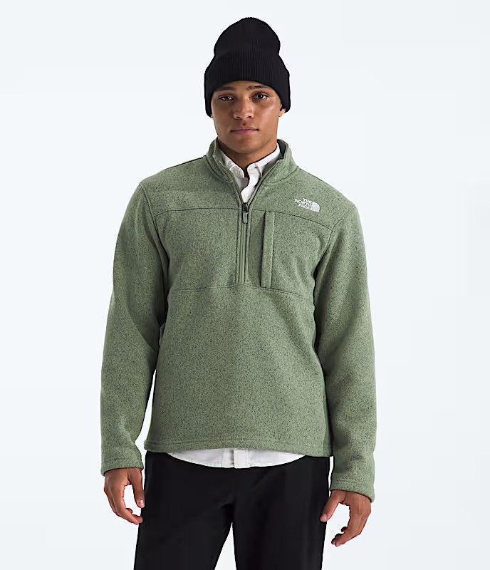 FRONT VIEW OF THE NORTH FACE MENS GORDON LYONS ¼ ZIP SWEATER FEATURES SOFT FLEECE FABRIC AND SECURE…