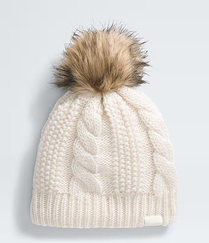 FRONT VIEW OF THE NORTH FACE WOMENS OH MEGA FUR POM LINED BEANIE WINTER HAT FEATURES ROOMY FIT AND …