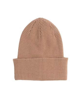 FRONT VIEW OF COAL UNISEX CROSSOVER WINTER HAT FEATURES SOFT PREMIUM FEEL AND WAFFLE STYLE WITH VER…