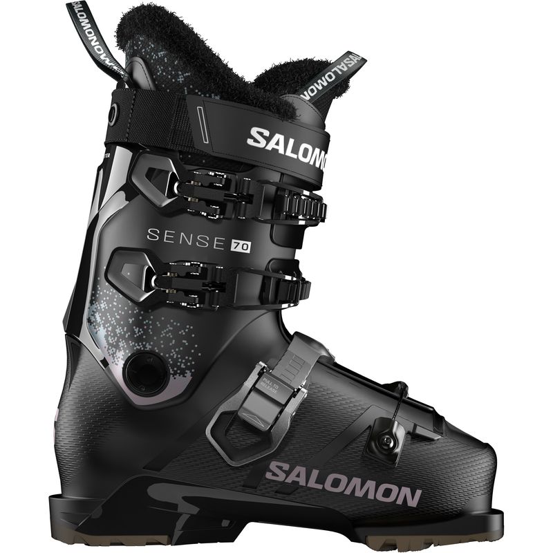 SIDE VIEW OF SALOMON WOMENS SENSE 70 GW DOWNHILL SKI BOOT FEATURES SOFT FLEX AND GRIPWALK SOLES FOR…