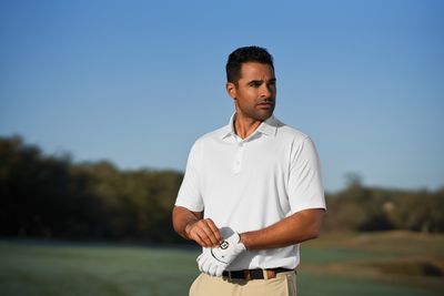 Men's golf polos feature comfortable, moisture-wicking materials, mobility, and stylish designs for optimal performance.