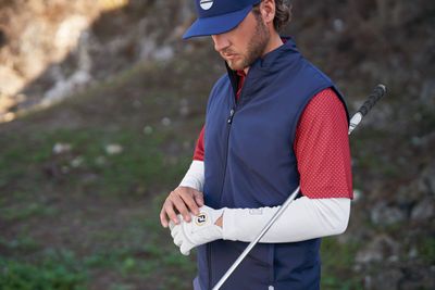 Men's cold weather wear features insulated jackets, thermal pants, and weather-resistant materials for warmth and comfort.