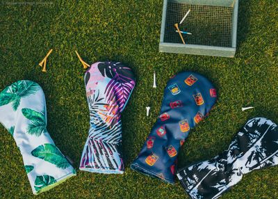 Essential golf accessories including gloves, tees, ball markers, and a stylish cap, enhancing your golfing experience.