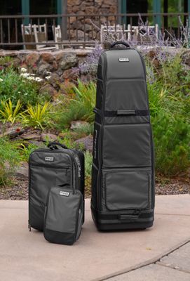 Travel golf bags with padded interiors and wheels for easy transport, designed to protect golf clubs during travel.
