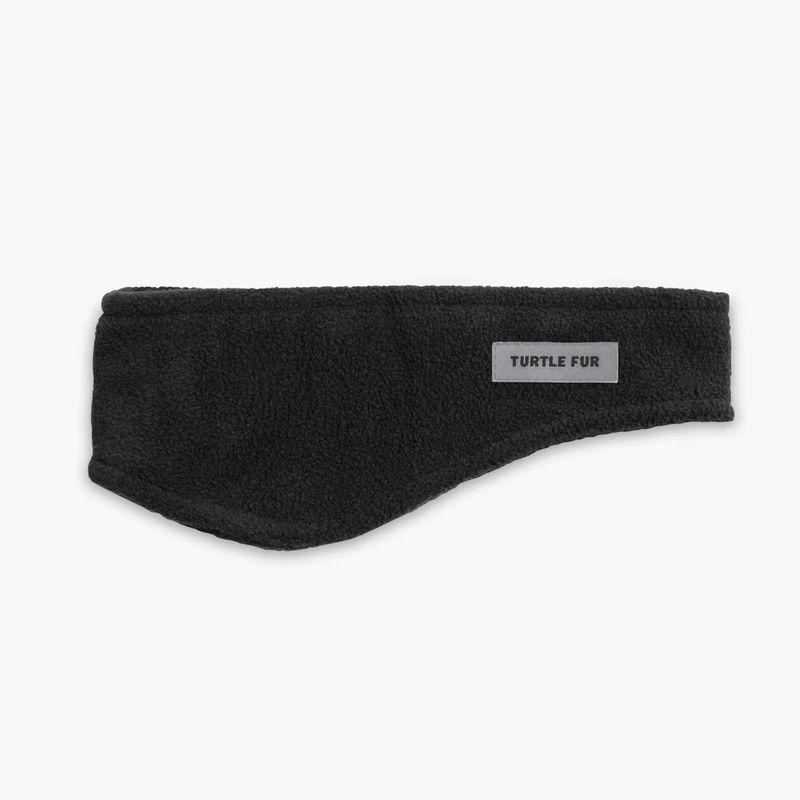 FRONT VIEW OF TURTLE FUR UNISEX CHELONIA 150 FLEECE BANG HEADBAND FEATURES SOFT FLEECE FABRIC AND W…