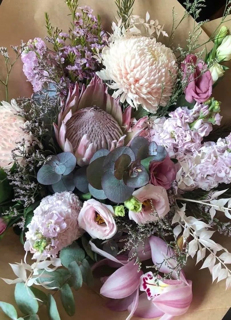 A Close Up of a Bouquet of Flowers Wrapped in Brown Paper — Flowers by Suzanne in Morpeth, NSW