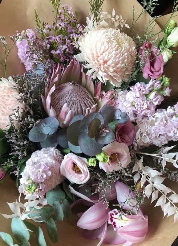 A Close Up of a Bouquet of Flowers Wrapped in Brown Paper — Flowers by Suzanne in Morpeth, NSW