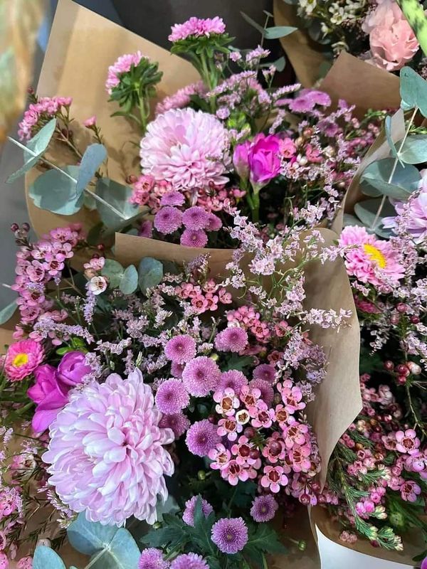 A Bunch of Pink Flowers Are Sitting on Top of Each Other on a Table — Flowers by Suzanne in Morpeth, NSW