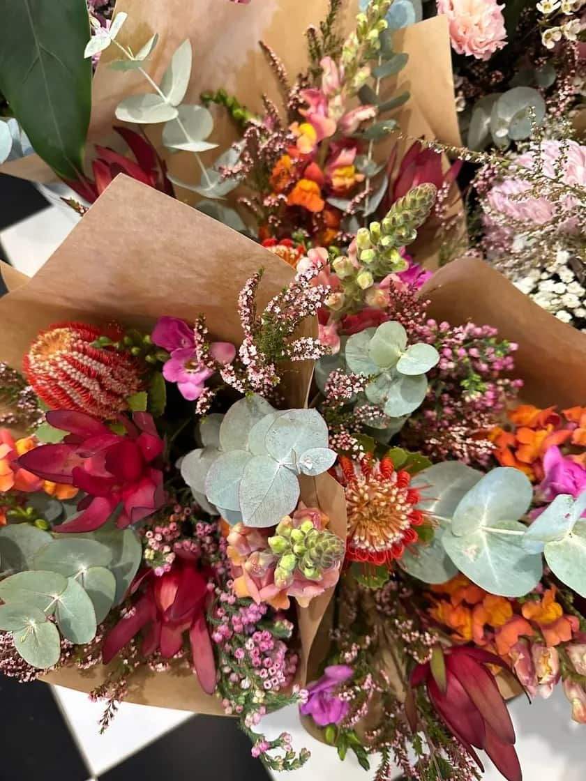 A Bunch of Pink Flowers Are Sitting on Top of Each Other on a Table — Flowers by Suzanne in Morpeth, NSW