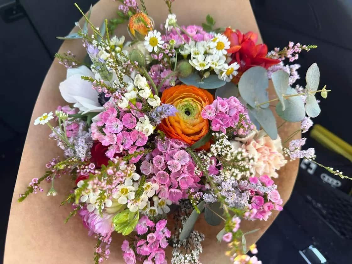 A Person is Holding a Bouquet of Flowers in Their Hand — Flowers by Suzanne in Morpeth, NSW