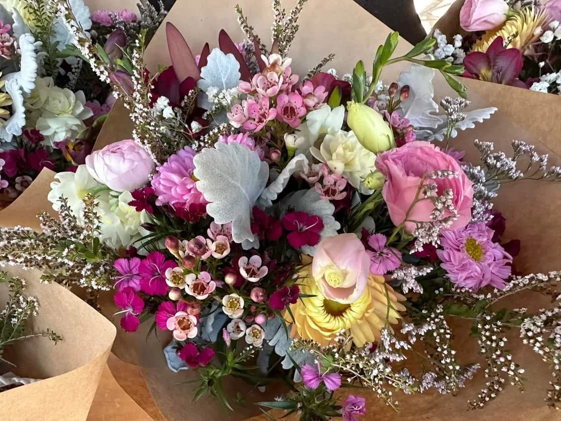 A Person is Holding a Bouquet of Flowers in Their Hand — Flowers by Suzanne in Morpeth, NSW