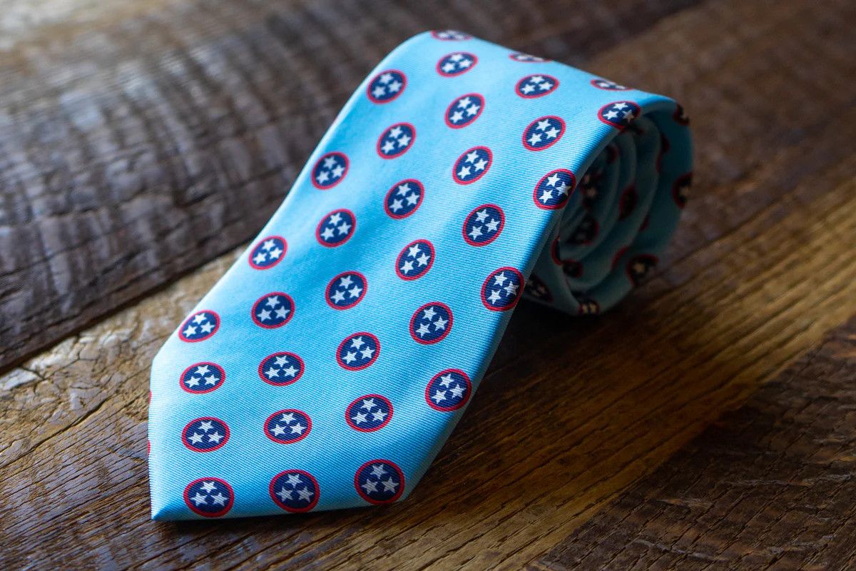 Volunteer Traditions Tristar tie stone blue