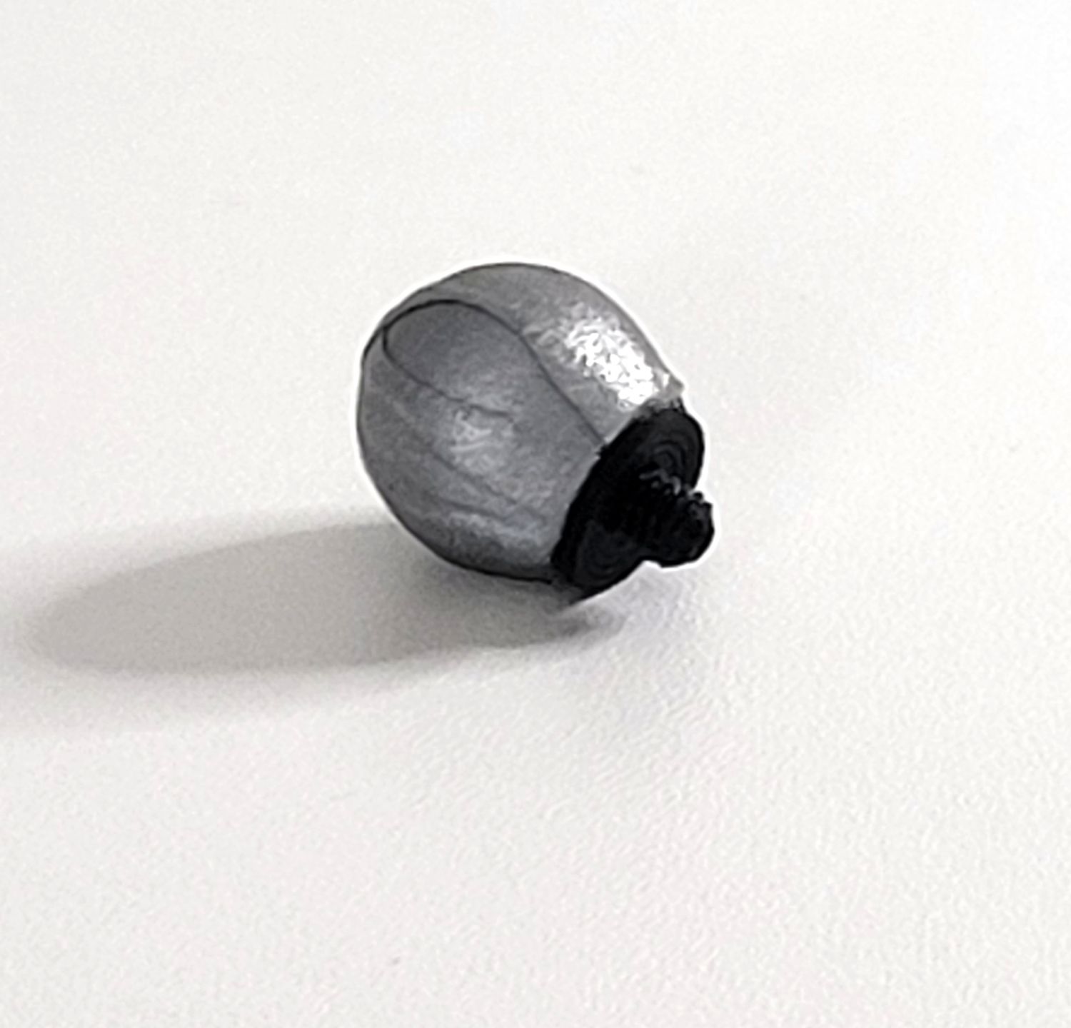 A close-up photo of a motion capture cluster marker with M4 screw for use with a cluster plate