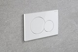 Plaque de commande double Geberit Sigma01 ronde, blanche, murale, à deux boutons.