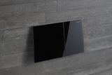 Geberit Sigma70 plaque de déclenchement, verre brillant noir, déclencheur frontal, design élégant et moderne.